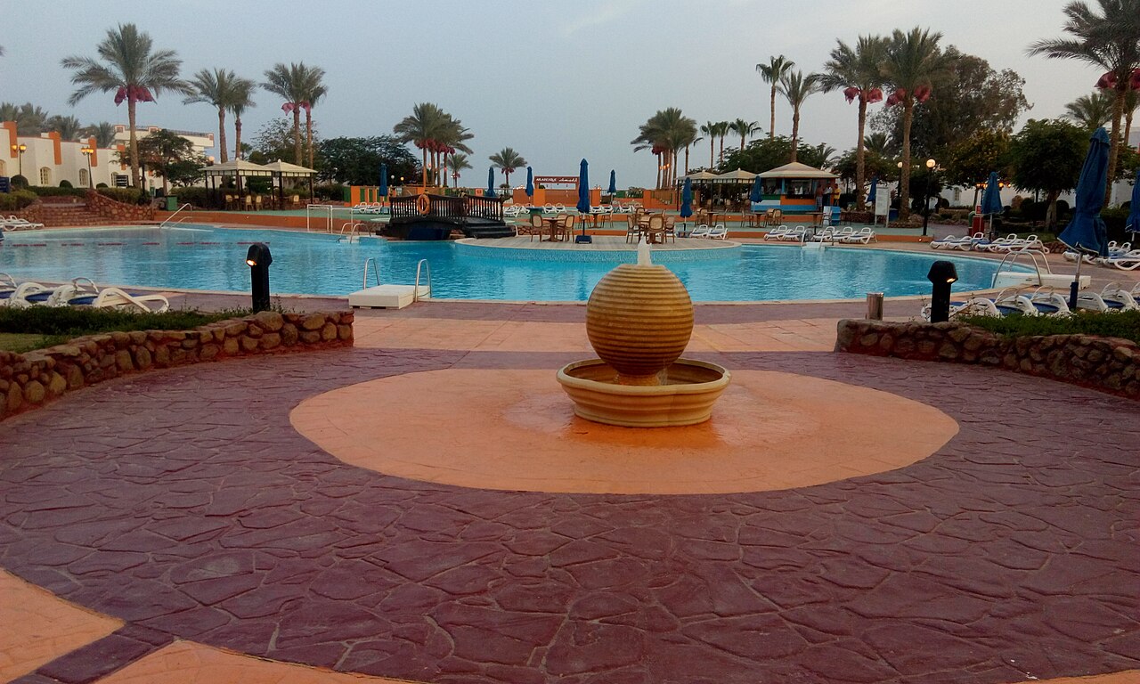 Swimming pool and resort buildings at Gafy Resort Aqua Park in Naama Bay