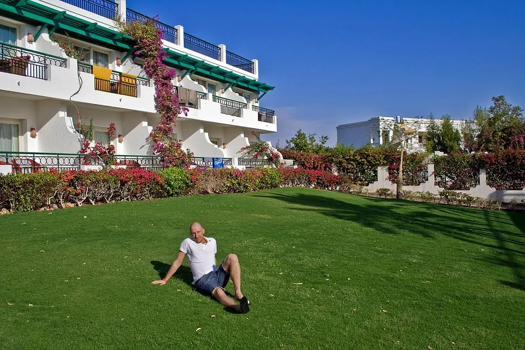 A garden-side hotel building at Safir Sharm Waterfalls Resort, photographed in 2016